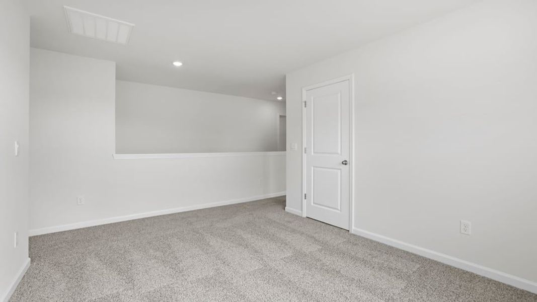 Spacious, unfurnished interior of a new home in Bentley Park, Greenwood (Image 25).