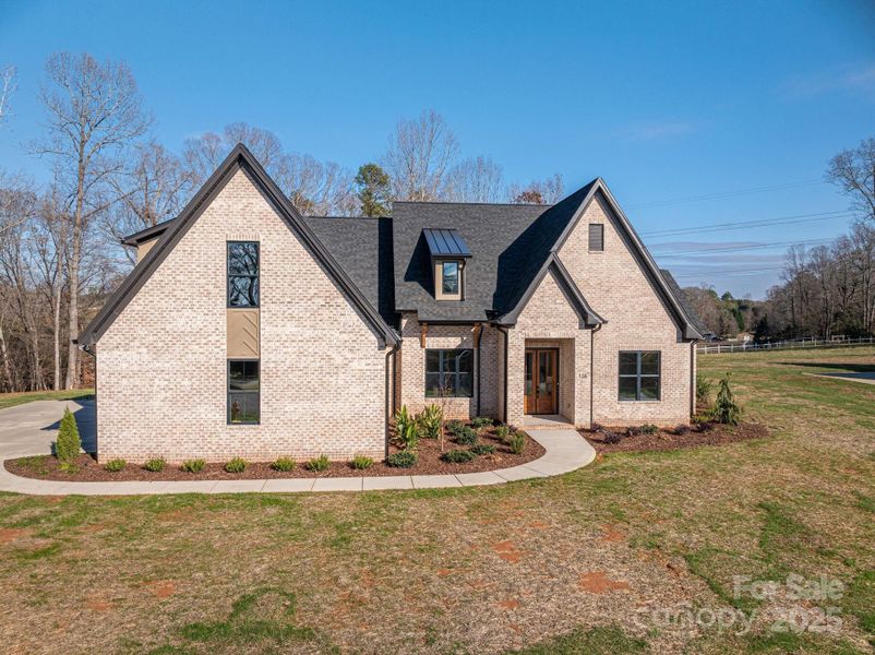 Front exterior of a new home in , Belmont, NC, highlighting curb appeal (Image 25).