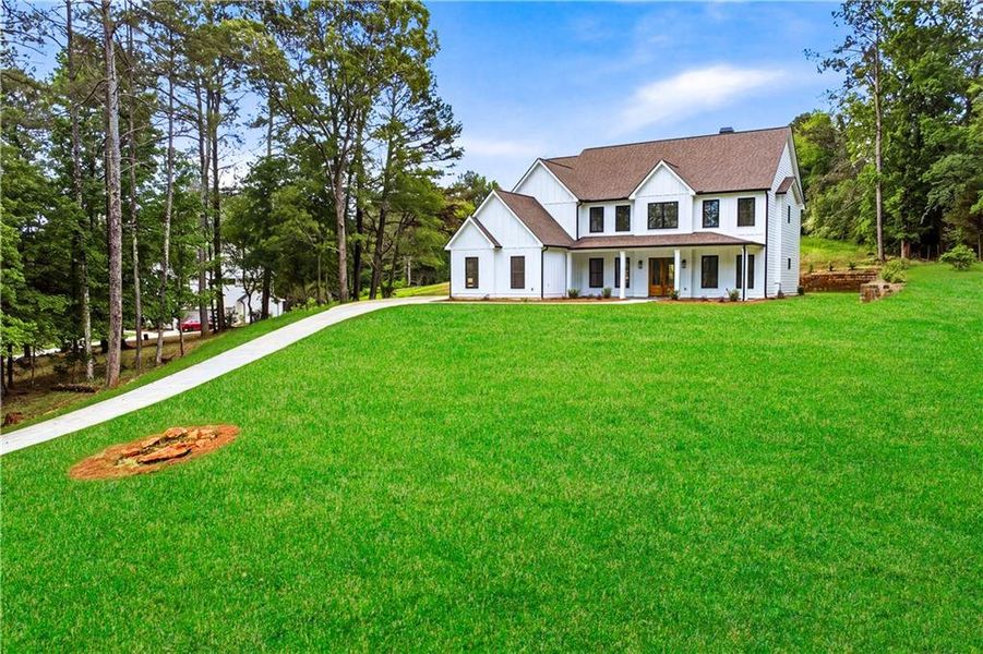 Front exterior of a new home in , Monroe, GA, highlighting curb appeal (Image 24).