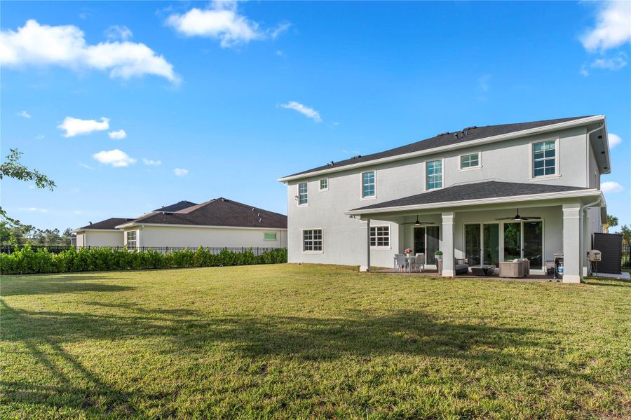 Exterior details and patio area of a home in Arden: The Waterford Collection, Loxahatchee (Image 3).