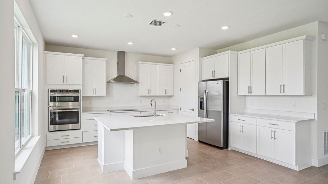 Plumeria Floor Plan featuring a bright kitchen with large island by DRB Homes in Trailside located in Mount Dora, FL Plumeria Floor Plan featuring a bright kitchen with large island by DRB Homes in Trailside located in Mount Dora, FL