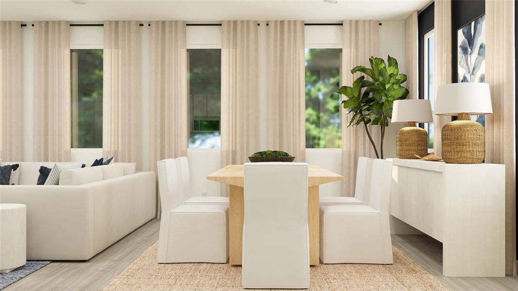 Dining space with light hardwood / wood-style flooring