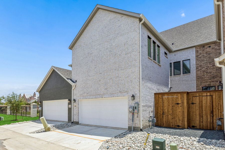 Exterior details and patio area of a home in Newman Village Townhomes, Frisco (Image 4). Exterior details and patio area of a home in Newman Village Townhomes, Frisco (Image 4).