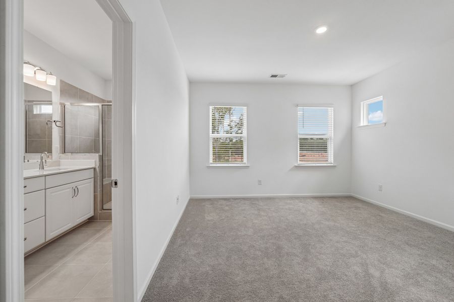 Spacious, unfurnished interior of a new home in Terraces at the Exchange, Indian Land (Image 39).