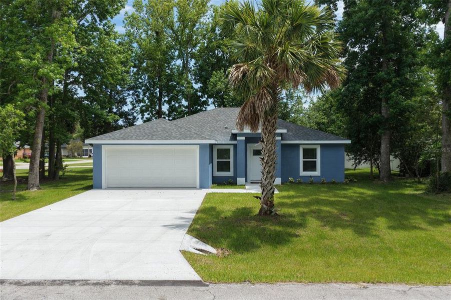 Front exterior of a new home in , Palm Coast, FL, highlighting curb appeal (Image 26). Front exterior of a new home in , Palm Coast, FL, highlighting curb appeal (Image 26).