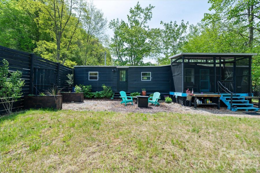 Enjoy the fenced yard area with established plantings.
