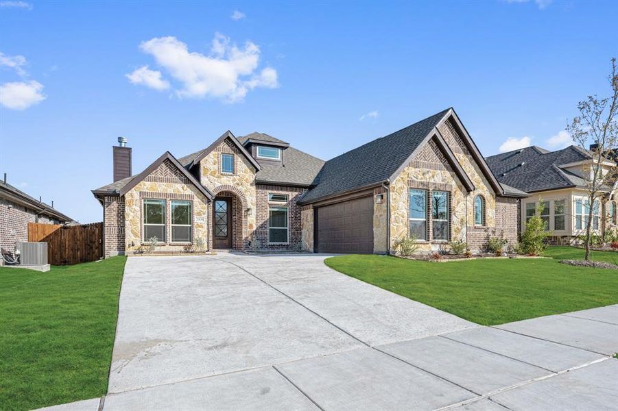 Front exterior of a new home in Meadow Vista 60-65, Anna, TX, highlighting curb appeal (Image 24). Front exterior of a new home in Meadow Vista 60-65, Anna, TX, highlighting curb appeal (Image 24).