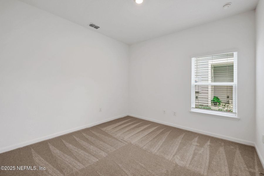 Spacious, unfurnished interior of a new home in TrailMark, St. Augustine (Image 39).