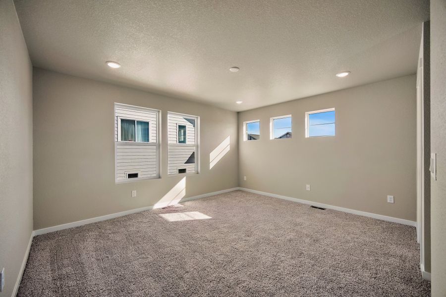 Spacious, unfurnished interior of a new home in Ridge at Lorson Ranch, Colorado Springs (Image 32).