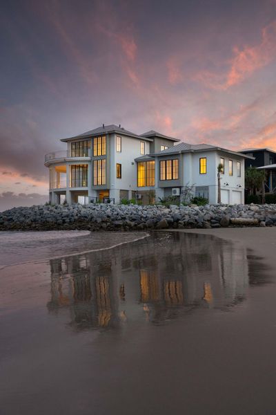 Front exterior of a new home in , Sullivan's Island, SC, highlighting curb appeal (Image 34).