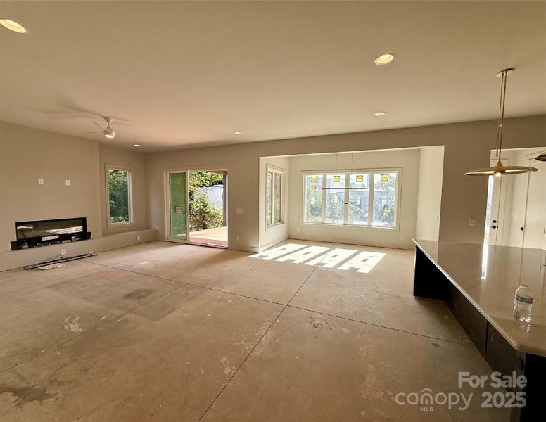 open living, dining, kitchen and outdoor space