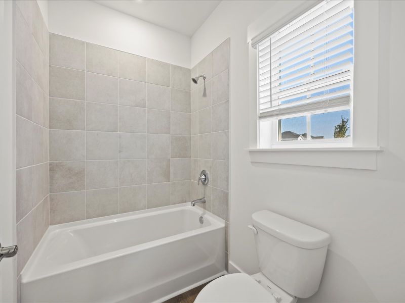 Furnished interior view inside a new home in The Coves at Lakes of Cane Bay II, Summerville (Image 13).