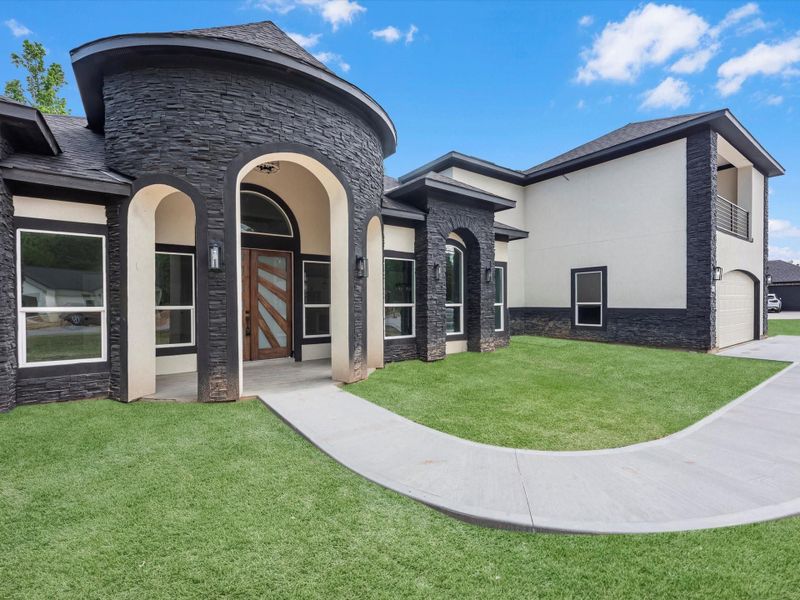 Front exterior of a new home in , Dayton, TX, highlighting curb appeal (Image 21).