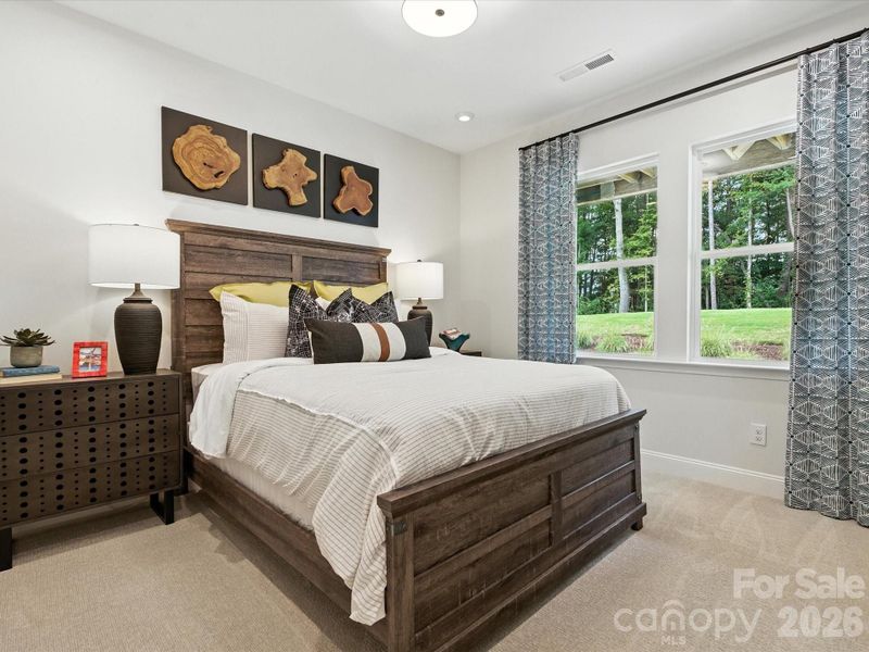 First Floor Guest Suite with Privacy and Bright Windows. *Model Photos | Actual Finishes, Structural Selections, and Orientation May Vary.