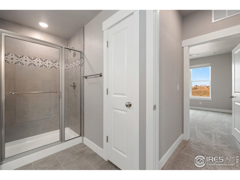 Primary shower & linen closet