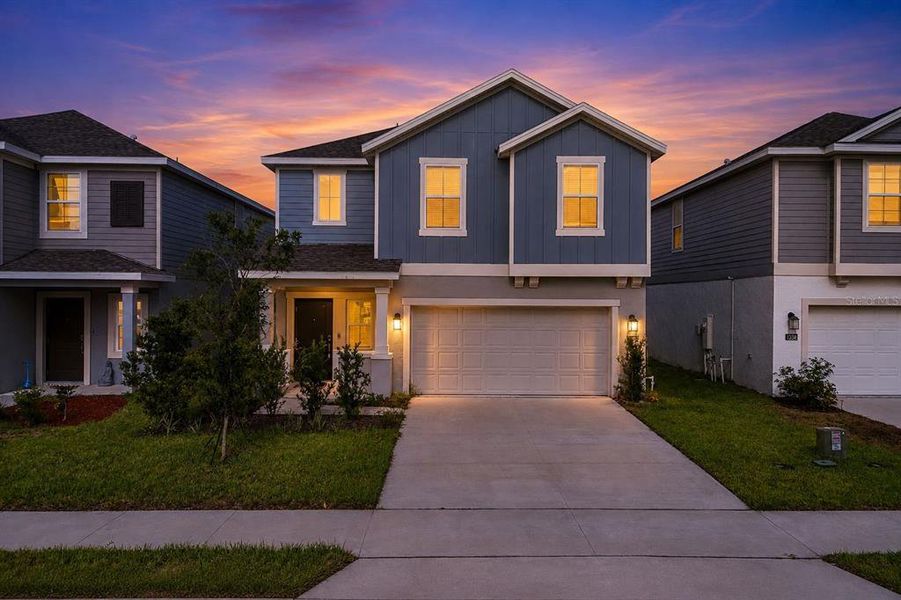Front exterior of a new home in Peace Creek Reserve, Winter Haven, FL, highlighting curb appeal (Image 28).