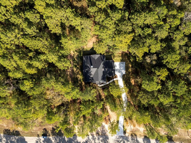 Front exterior of a new home in , New Waverly, TX, highlighting curb appeal (Image 28). Front exterior of a new home in , New Waverly, TX, highlighting curb appeal (Image 28).