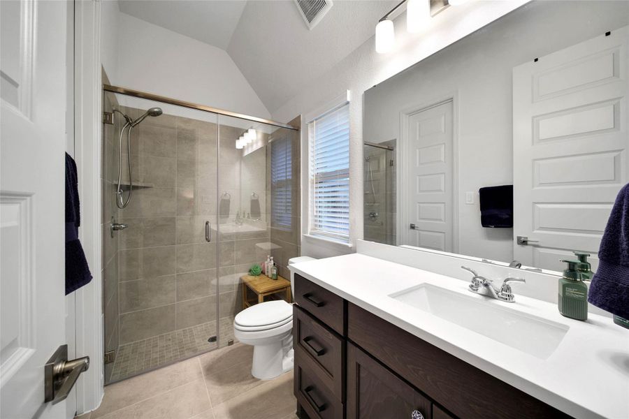 The private bath offers a walk-in shower and very large secondary closet space.