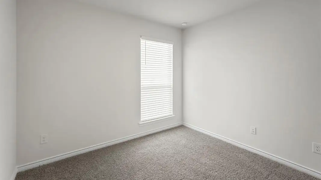Neutral wall tones complement the window with horizontal blinds, recessed lighting, and soft carpet flooring
