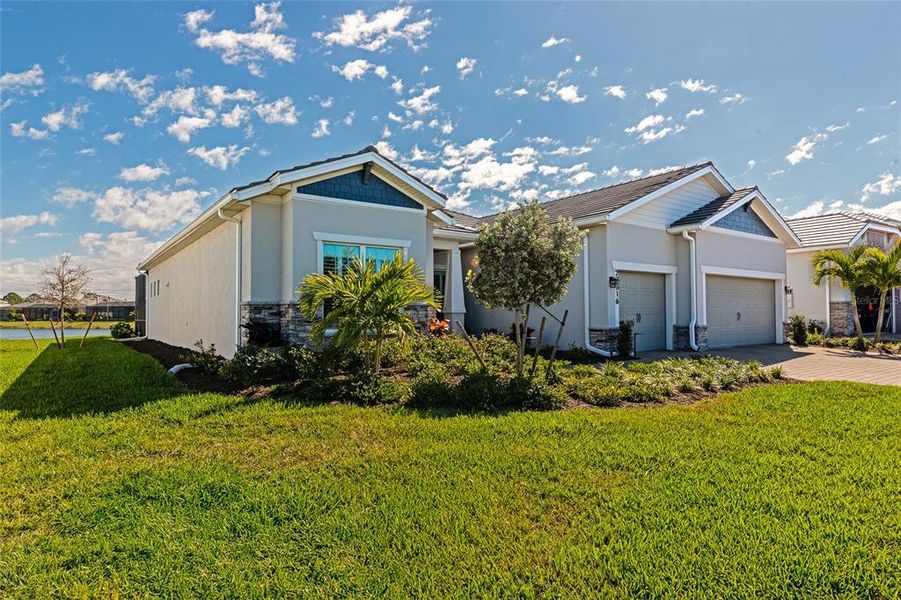 Front exterior of a new home in , Englewood, FL, highlighting curb appeal (Image 26). Front exterior of a new home in , Englewood, FL, highlighting curb appeal (Image 26).