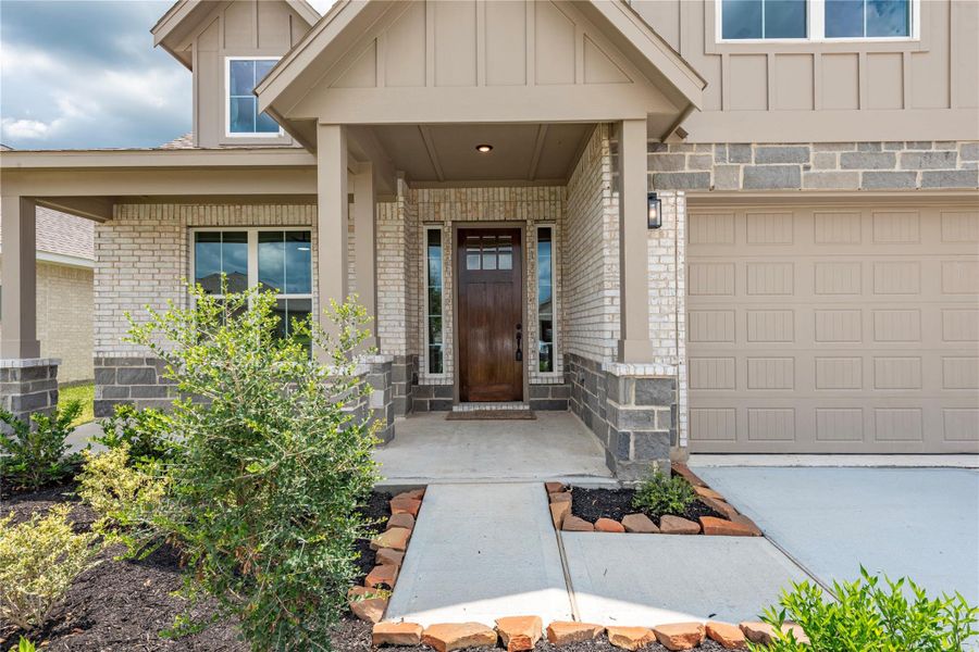 Front exterior of a new home in , Santa Fe, TX, highlighting curb appeal (Image 1). Front exterior of a new home in , Santa Fe, TX, highlighting curb appeal (Image 1).