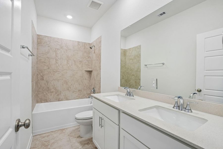 Furnished interior view inside a new home in Riviera Pines - Premier Series, Huffman (Image 6).