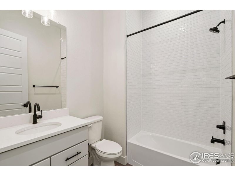 Tub with tile to ceiling