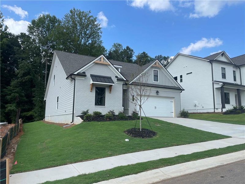 Front exterior of a new home in Summerlin, Winder, GA, highlighting curb appeal (Image 23).