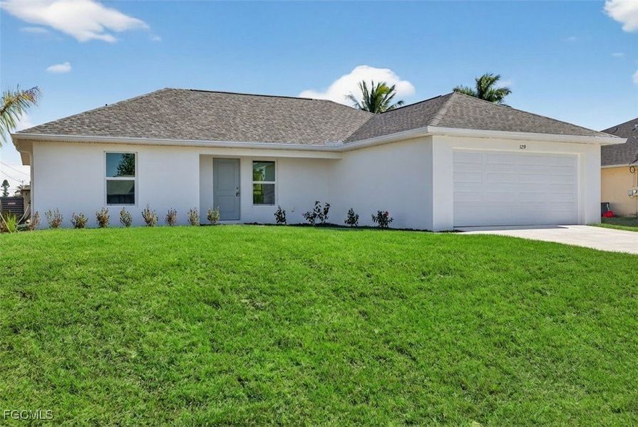 Front exterior of a new home in Cape Coral, Cape Coral, FL, highlighting curb appeal (Image 1). Front exterior of a new home in Cape Coral, Cape Coral, FL, highlighting curb appeal (Image 1).