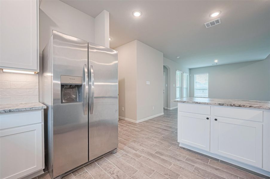 Furnished interior view inside a new home in Sunterra, Katy (Image 5).