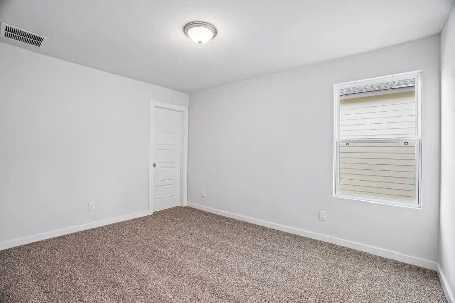 Spacious, unfurnished interior of a new home in The Meadows at Hunters Ranch, San Antonio (Image 32).