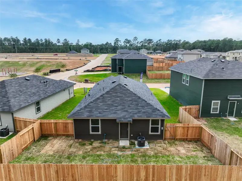 Front exterior of a new home in McCrorey Trails, Conroe, TX, highlighting curb appeal (Image 1).