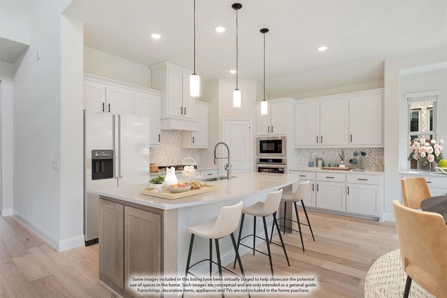 Kitchen with white cabinets, center island with bar seating, pendant lights, and light wood floors Kitchen with white cabinets, center island with bar seating, pendant lights, and light wood floors