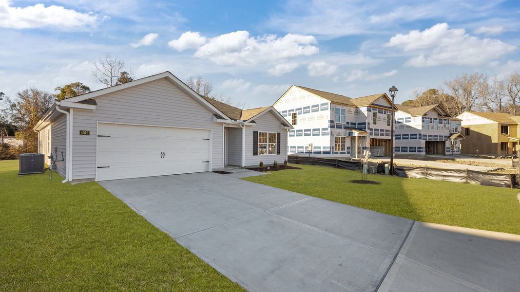 Front exterior of a new home in Madeline Farm, New Bern, NC, highlighting curb appeal (Image 2). Front exterior of a new home in Madeline Farm, New Bern, NC, highlighting curb appeal (Image 2).