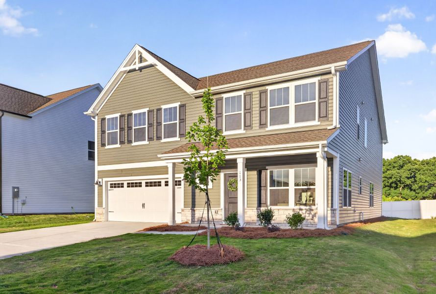 Front exterior of a new home in Morrow Brook, Albemarle, NC, highlighting curb appeal (Image 1). Front exterior of a new home in Morrow Brook, Albemarle, NC, highlighting curb appeal (Image 1).