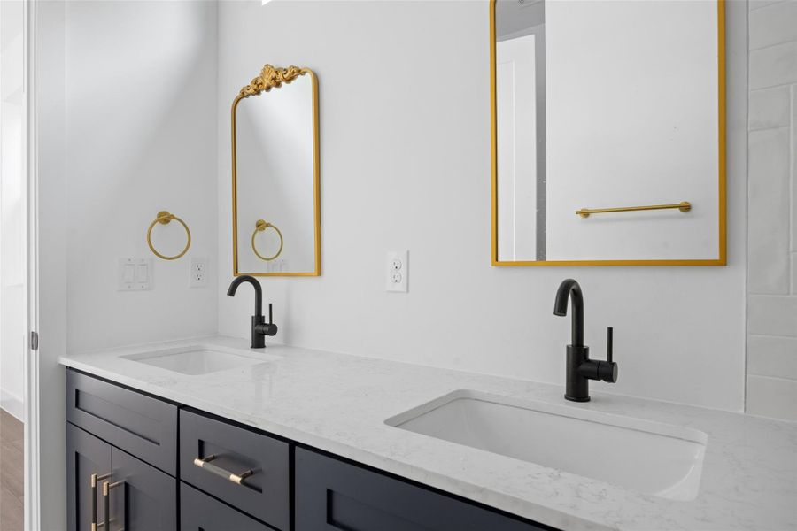 Full bath featuring double vanity Full bath featuring double vanity