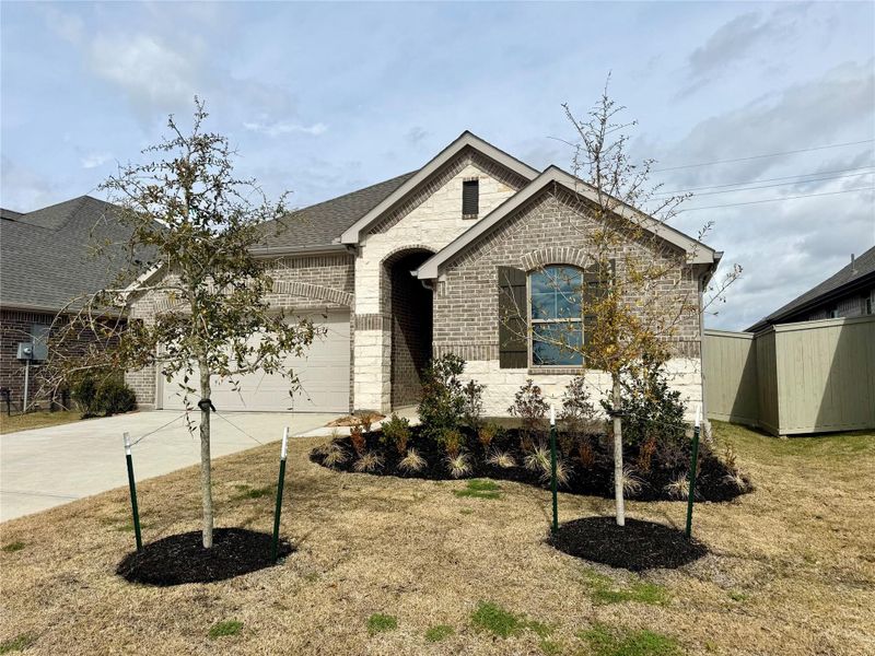 Front exterior of a new home in Westland Ranch, League City, TX, highlighting curb appeal (Image 22).