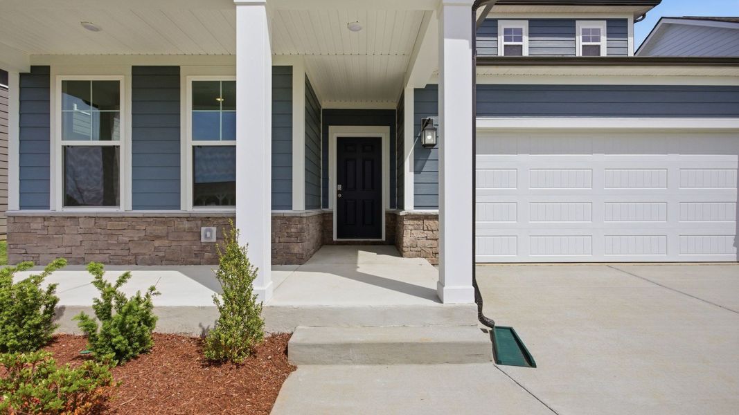 Covered entry with black door Covered entry with black door
