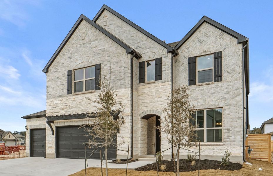 Front exterior of a new home in Bluffview Reserve, Leander, TX, highlighting curb appeal (Image 22).