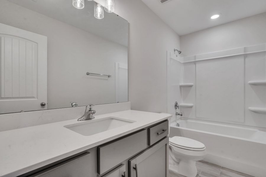 Representative furnished interior of a home built from the The Hatteras by Smith Family Homes in Ramsey Landing, Rincon (Image 17).
