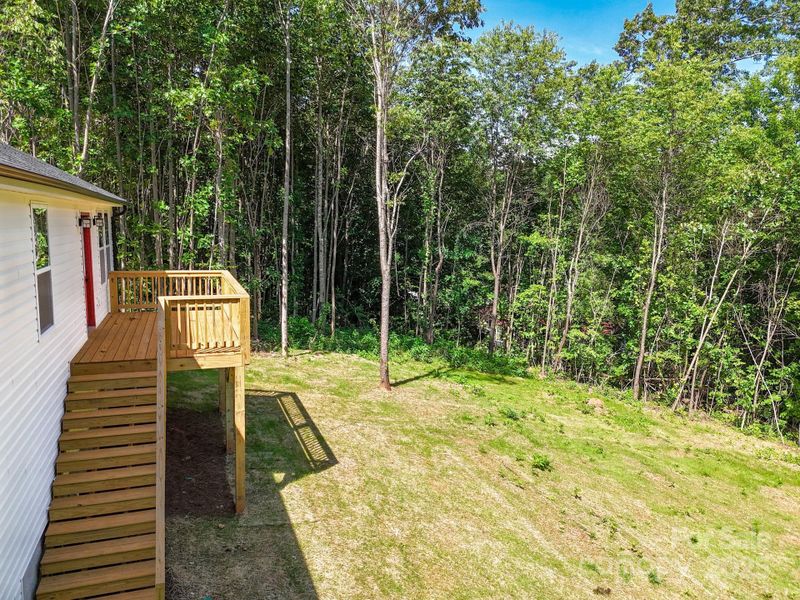 Front exterior of a new home in , Candler, NC, highlighting curb appeal (Image 26). Front exterior of a new home in , Candler, NC, highlighting curb appeal (Image 26).