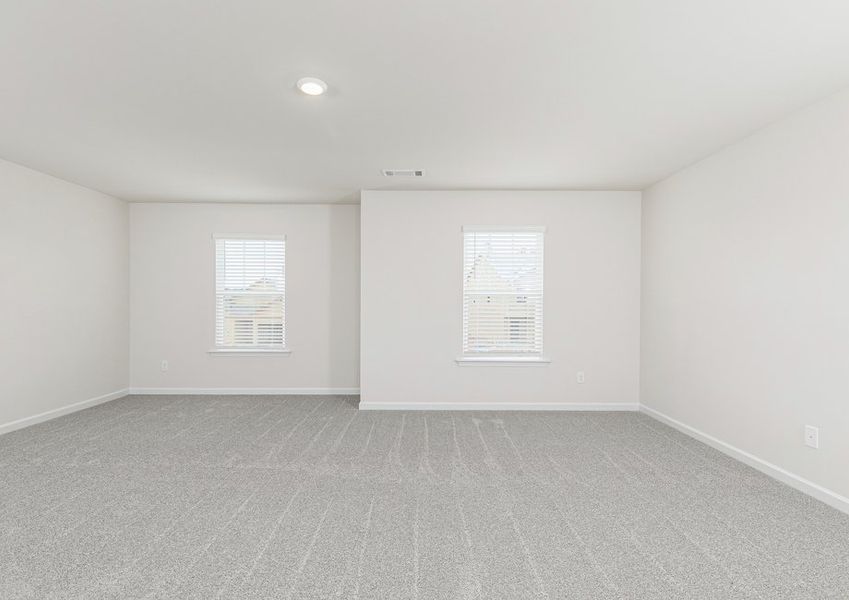 Rest and relaxation await in the master bedroom