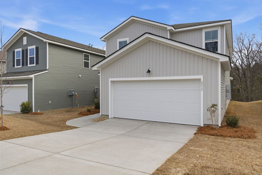 Front exterior of a new home in Grand Arbor, Blythewood, SC, highlighting curb appeal (Image 19).