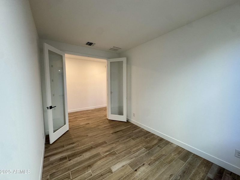 Den with glass doors