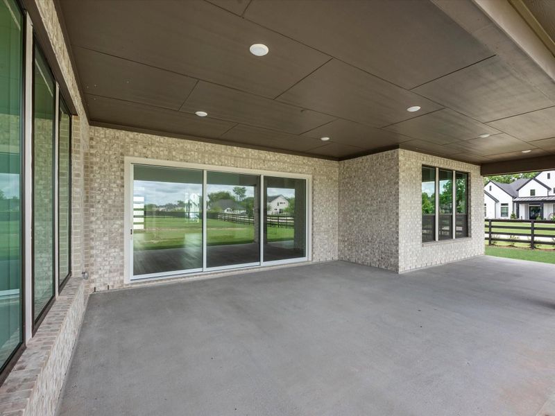 Exterior details and patio area of a home in The Estates at James Lane, Fulshear (Image 4).