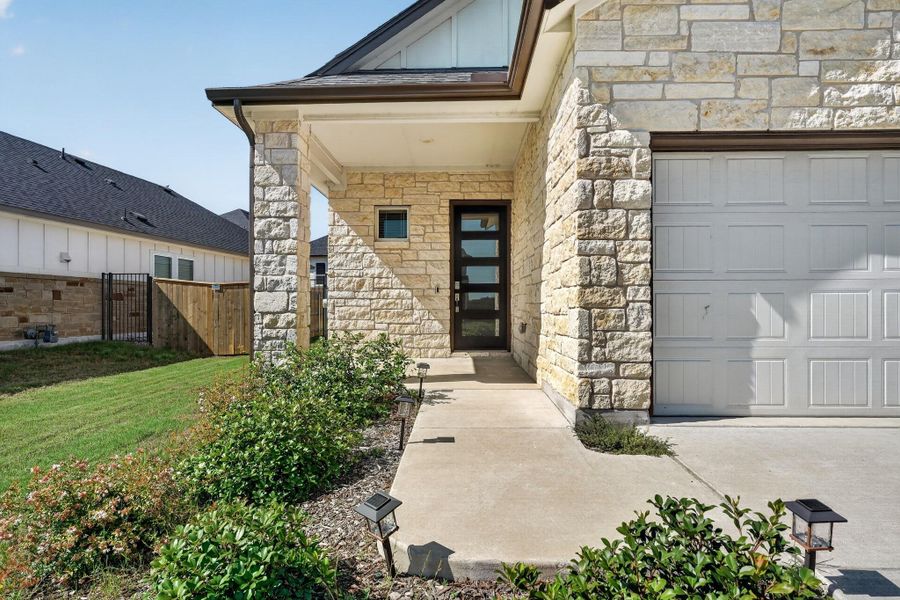 Exterior details and patio area of a home in Cascades at Onion Creek, Austin (Image 27).