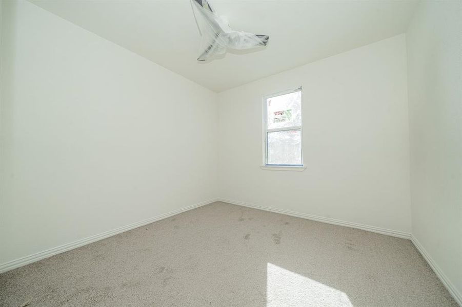 3rd bedroom with carpet flooring and ceiling fan