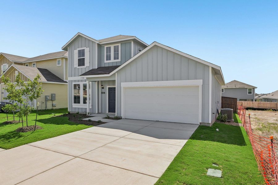 Front exterior of a new home in Edgebrooke, Pflugerville, TX, highlighting curb appeal (Image 2). Front exterior of a new home in Edgebrooke, Pflugerville, TX, highlighting curb appeal (Image 2).