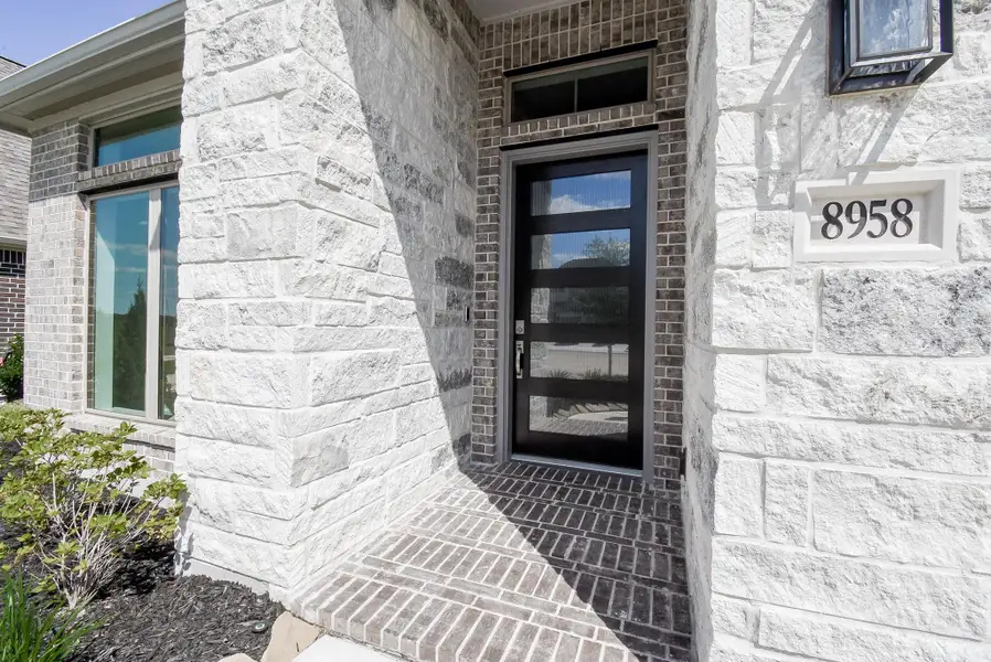 Exterior details and patio area of a home in Marvida, Cypress (Image 4).