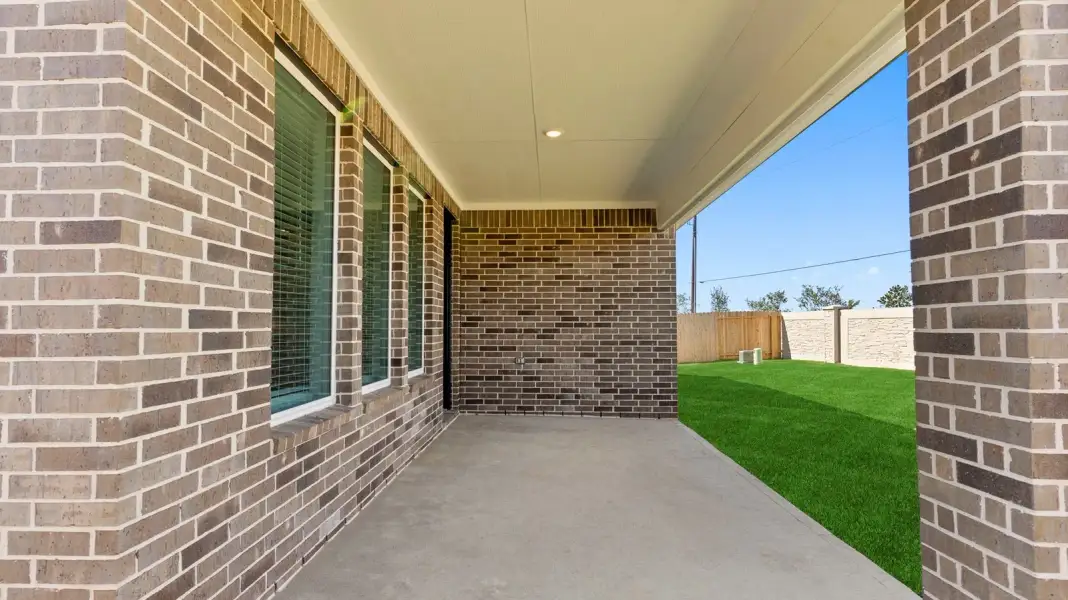 Exterior details and patio area of a home in Alexander 65' Homesites, Pearland (Image 2).
